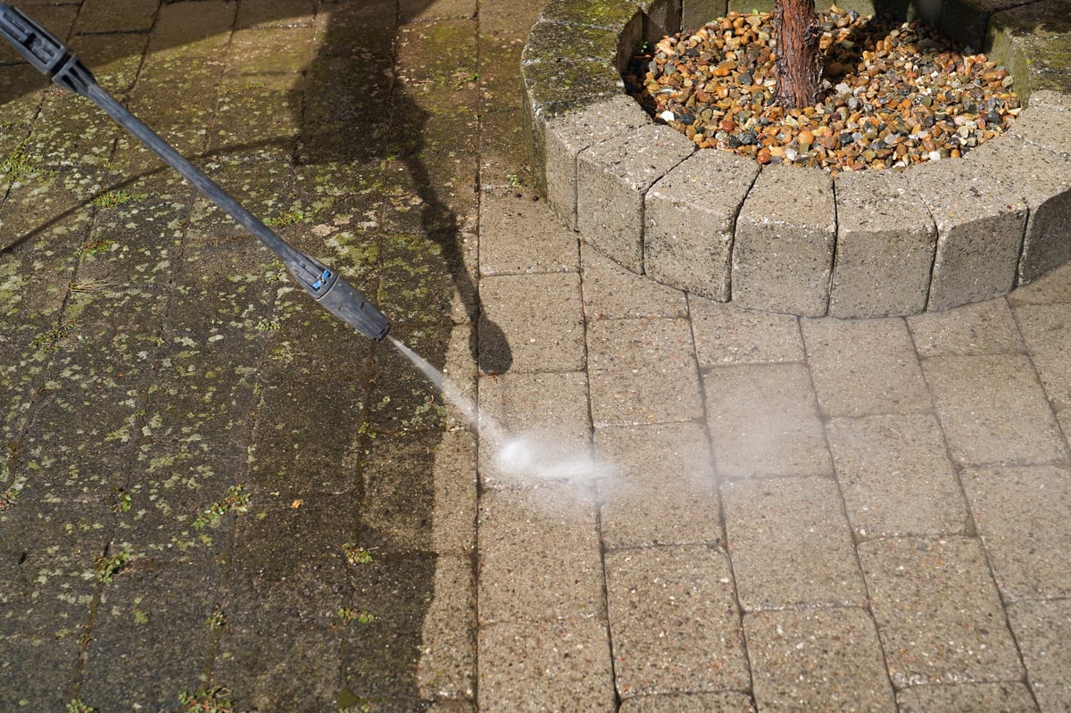 Pressure washing before and after on an outdoor surface