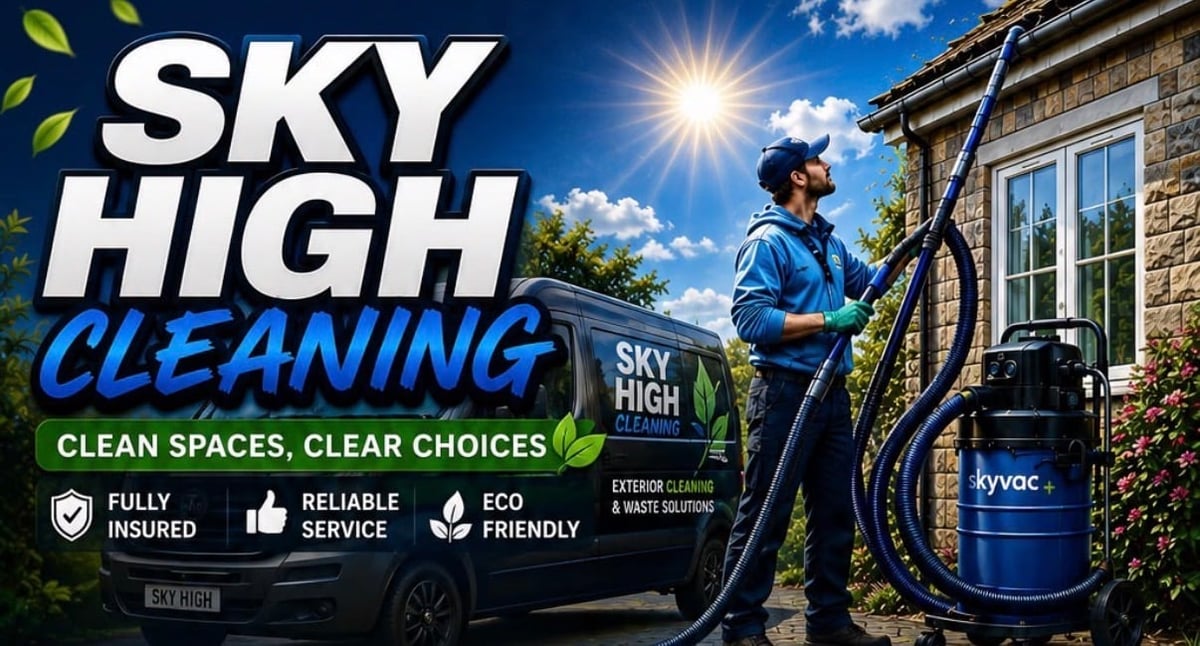 Sky High Cleaning worker with a pressure washer van cleaning a residential building exterior
